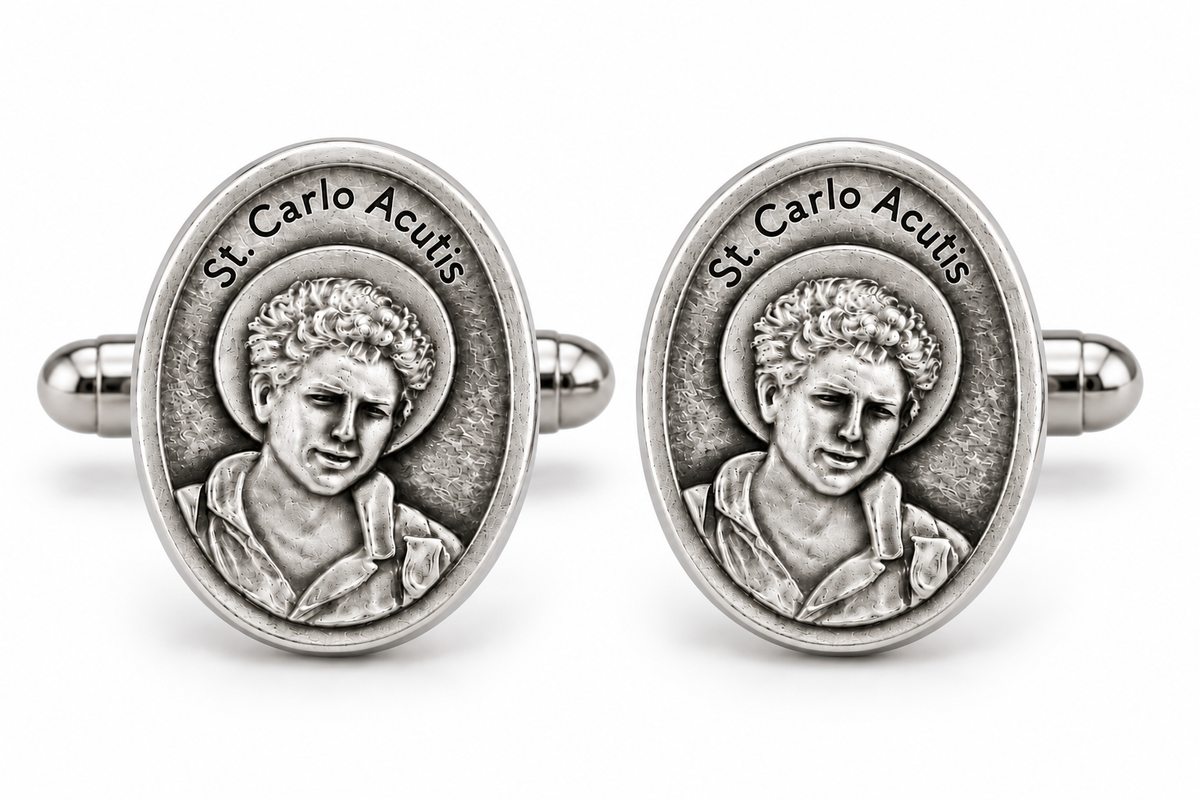 A pair of oval silver-toned cufflinks featuring a raised relief portrait of St. Carlo Acutis 
