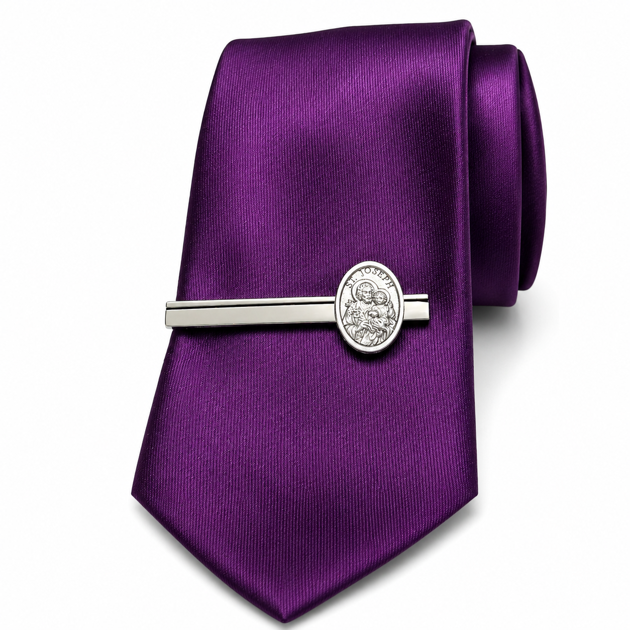 Purple tie with a silver tie clip on a white background