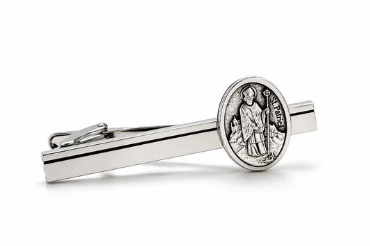 A silver-toned tie bar featuring an oval Saint Patrick coin medallion on the end, displayed on a clean white background.