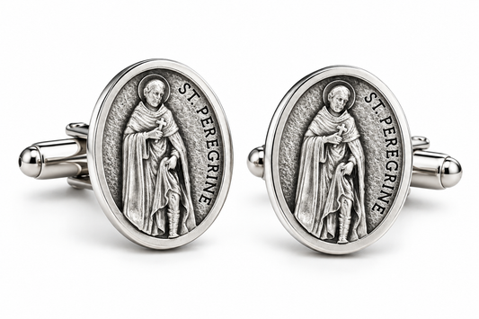A pair of oval cufflinks featuring a raised silver-toned medallion of Saint Peregrine, with the text 'ST. PEREGRINE' visible around the figure, set against a clean white background.