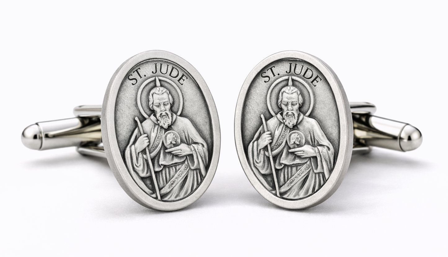 Silver St. Jude-themed cufflinks on a white background