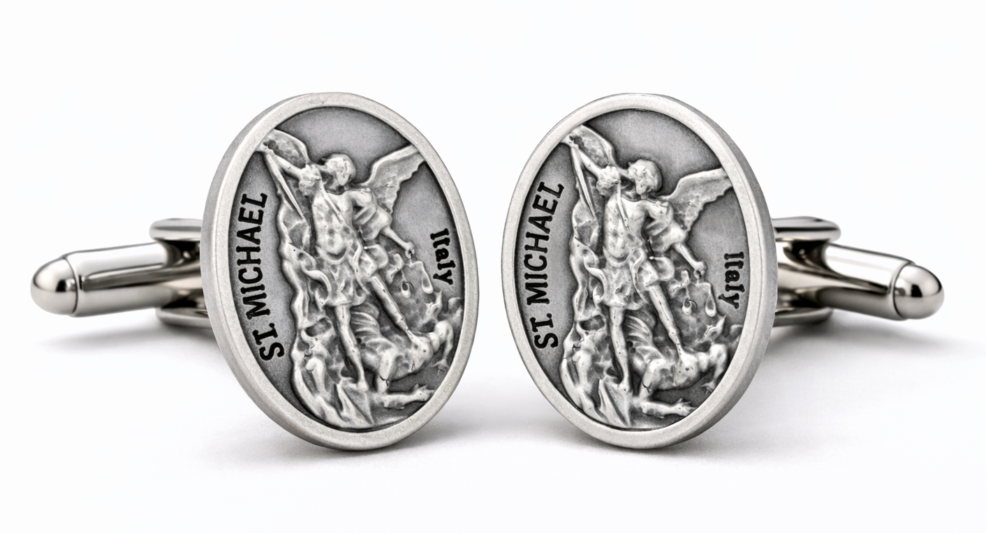 Silver St. Michael cufflinks on a white background