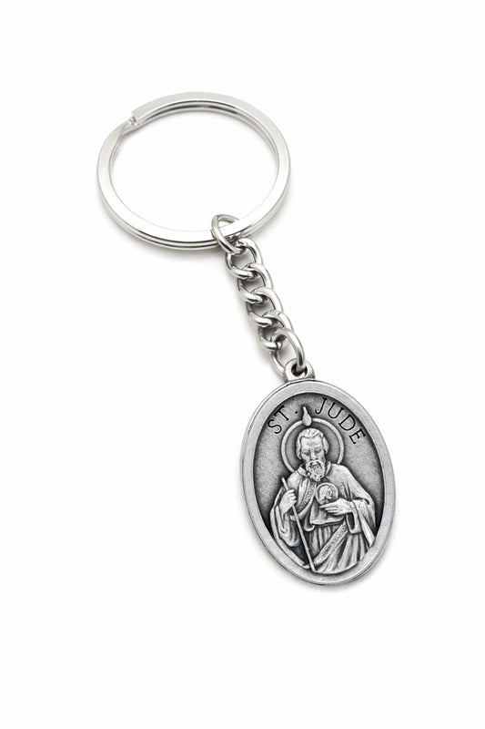 St Jude Catholic keychain with antique silver religious medal on white background