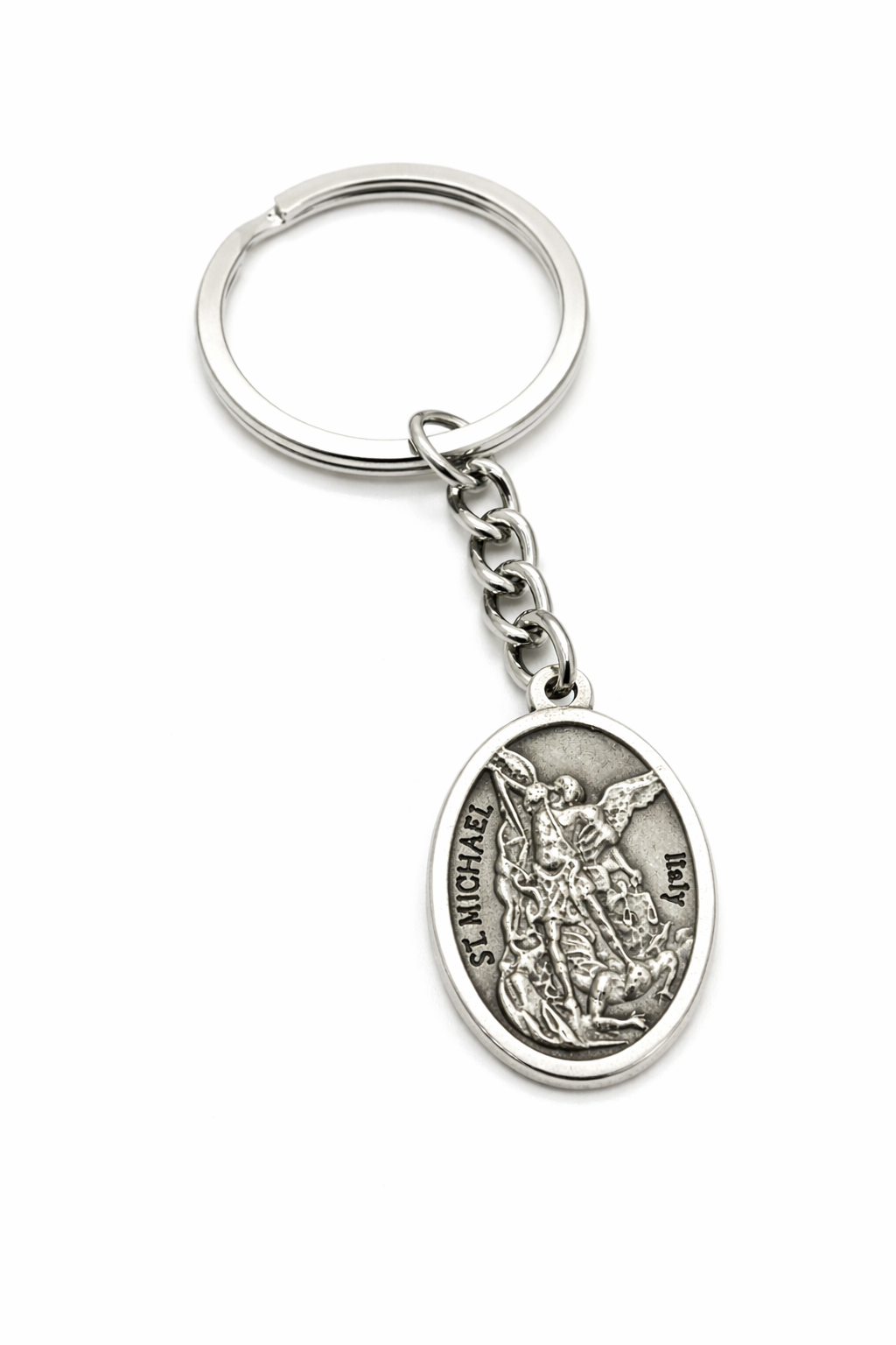 St Michael Archangel keychain with antique silver Catholic medal on white background