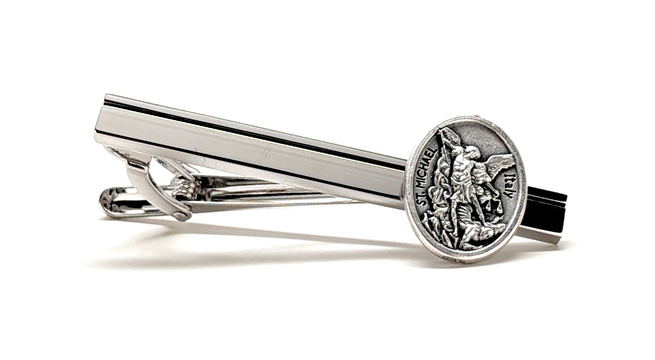 St Michael Silver tie clip with a detailed emblem on a white background