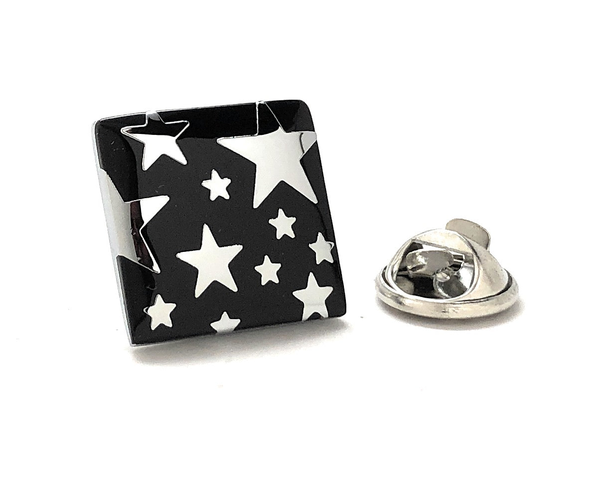 Black and silver star lapel pin with glossy enamel and butterfly clutch backing – night sky accessory