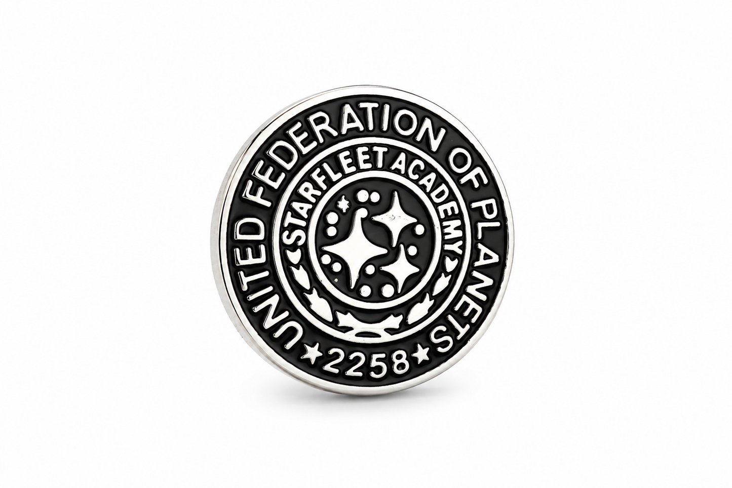 Circular badge with 'United Federation of Planets Starfleet Academy' text on a white background