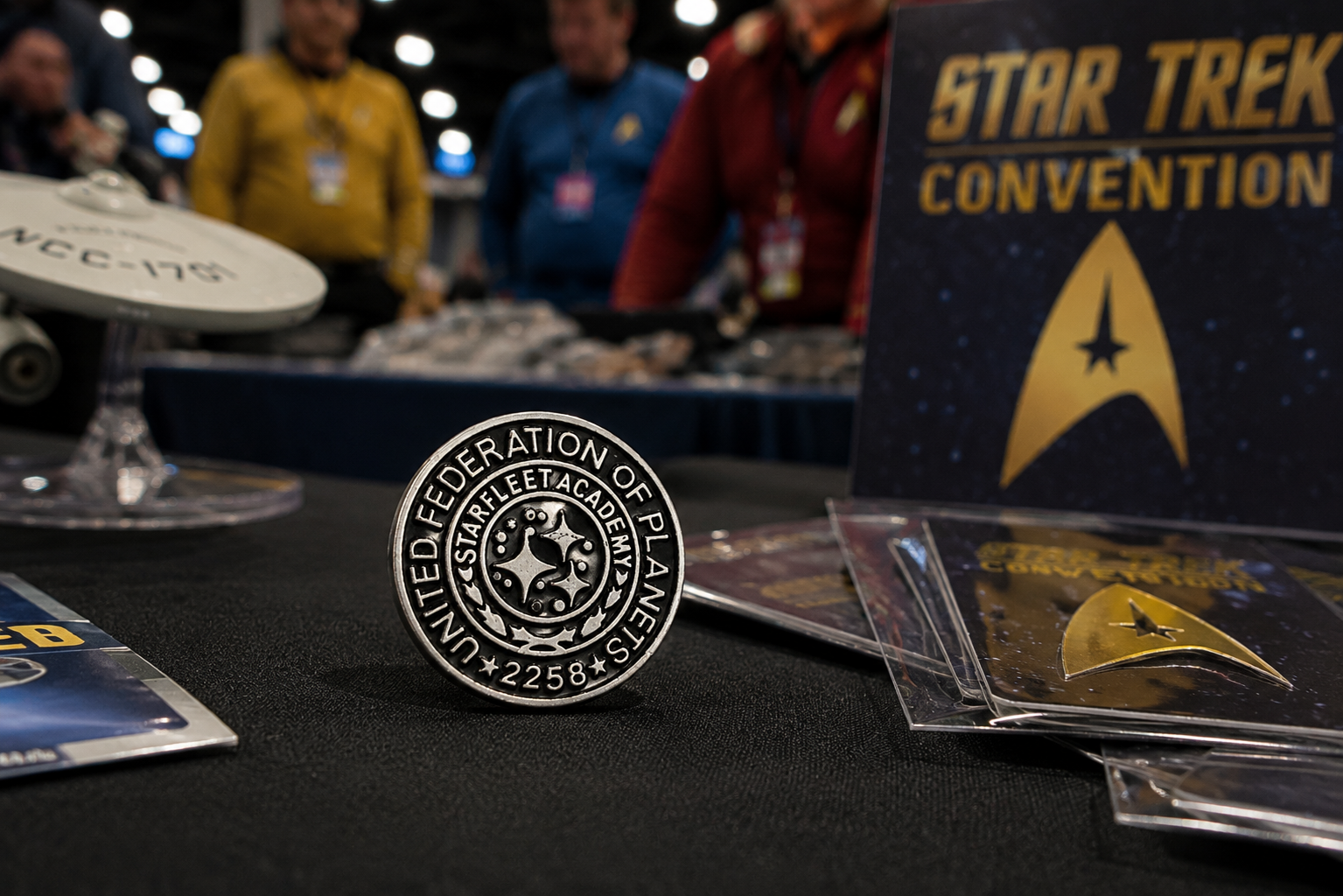 Star Trek convention badge and merchandise on a table