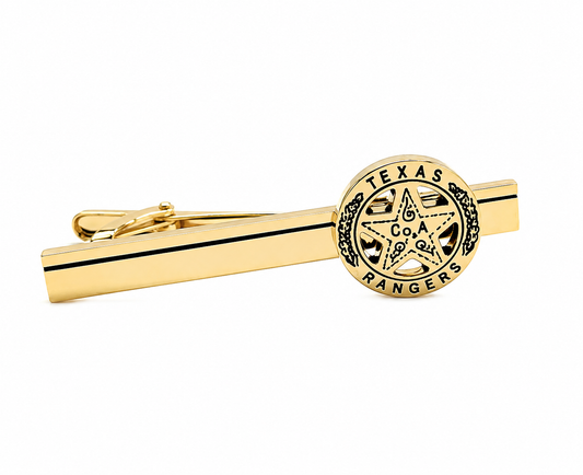 A gold tie bar featuring a circular Texas Rangers emblem on one end, shown against a plain white background.