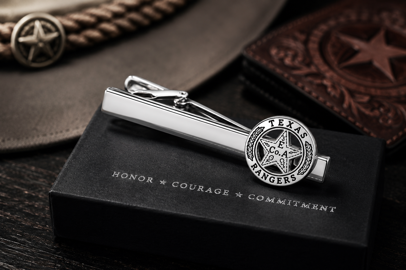 Polished silver Texas Ranger badge tie clip inspired by the legendary Old West lawmen, shown on a clean white background. Gift box night stand