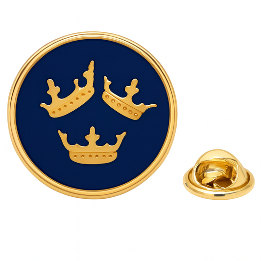 Round blue and gold lapel pin with three crowns on a white background