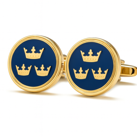 Gold cufflinks with blue background and crown design on a white background