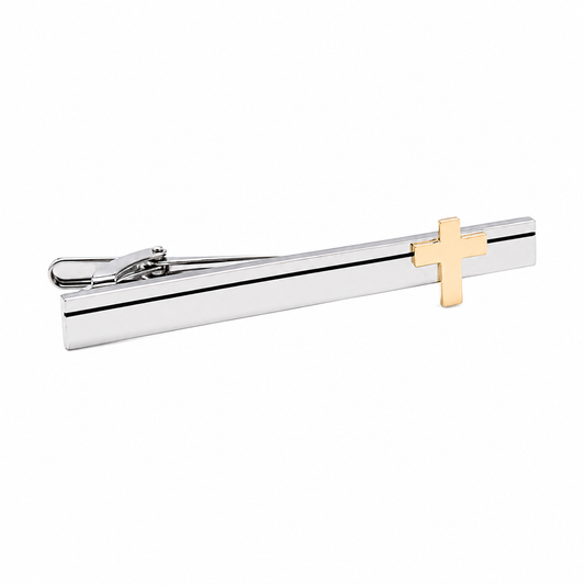 Silver tie clip with a gold cross on a white background