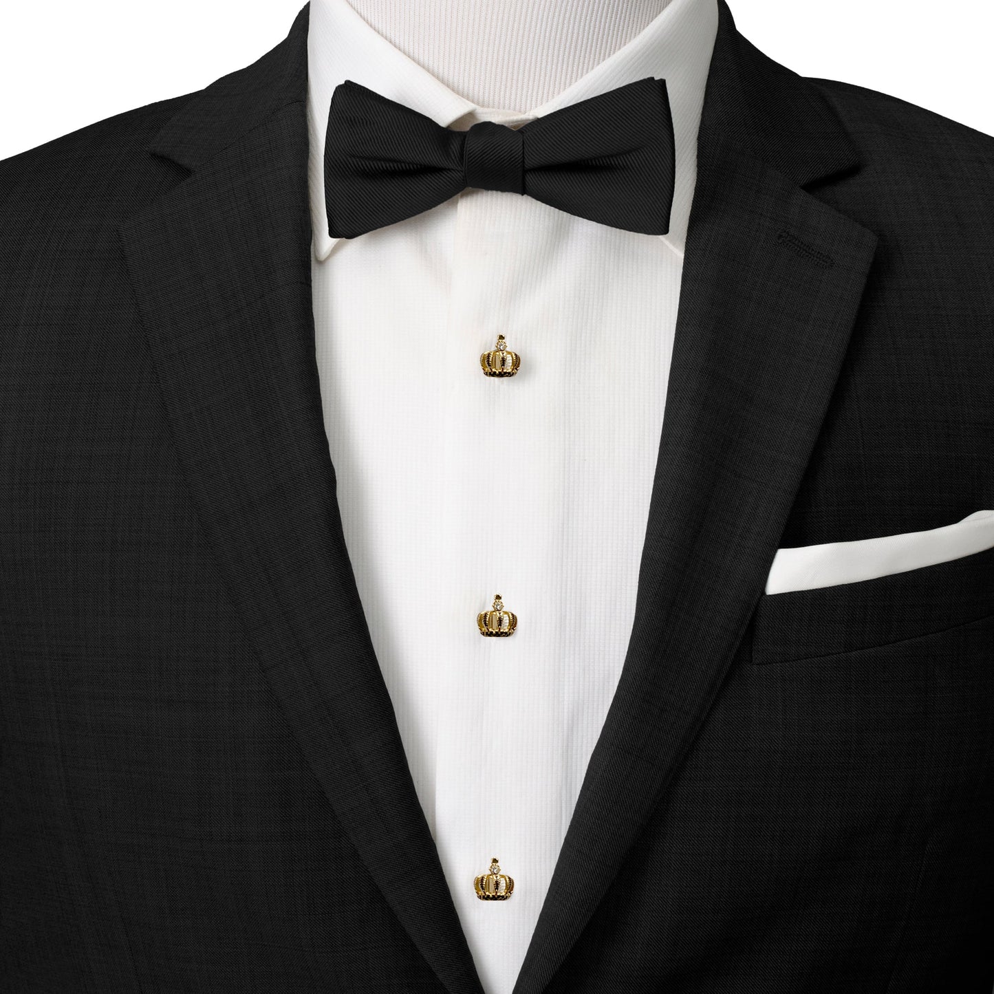 Black tuxedo with a bow tie and gold crown lapel pins on a white background