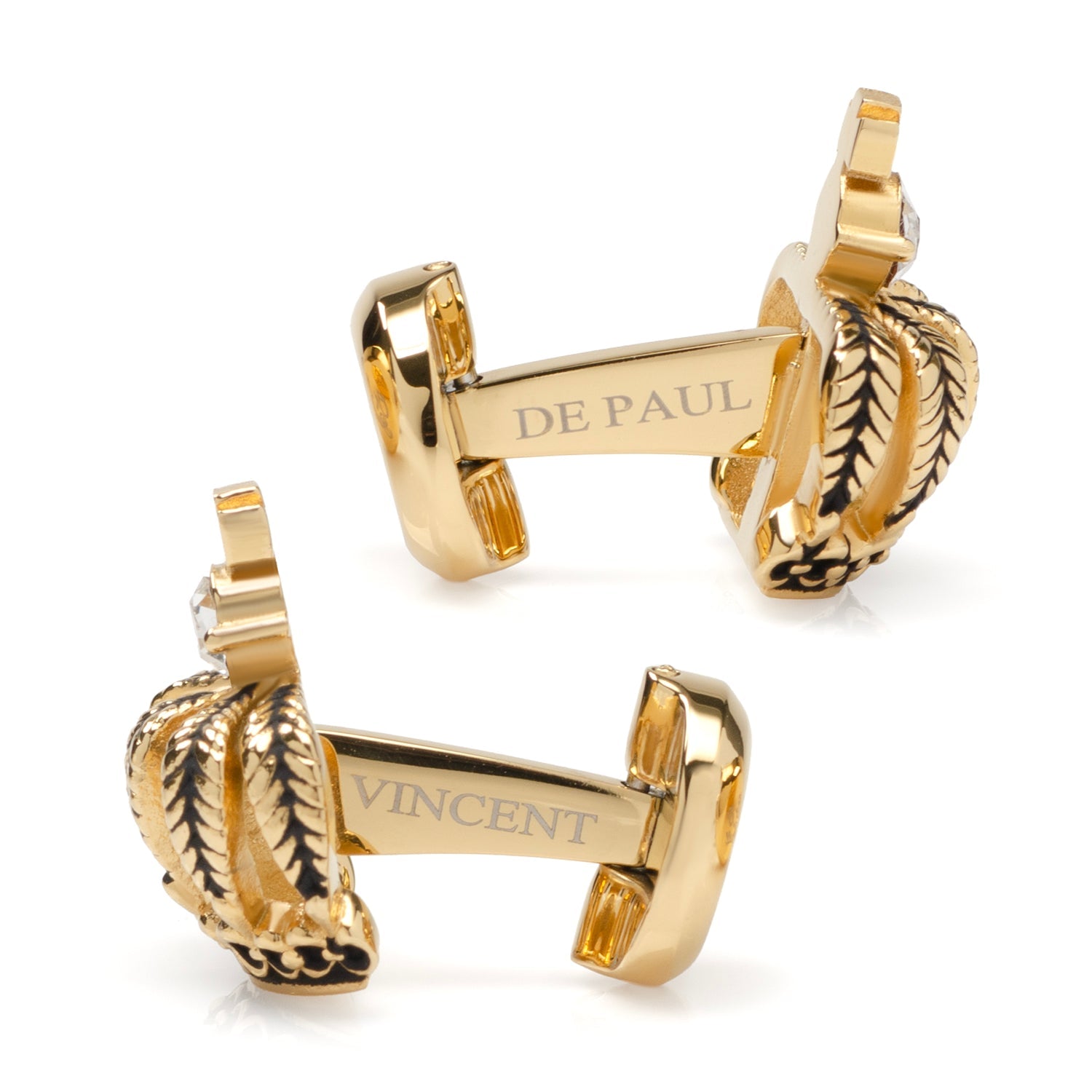 Gold cufflinks with 'De Paul' and 'Vincent' branding on a white background