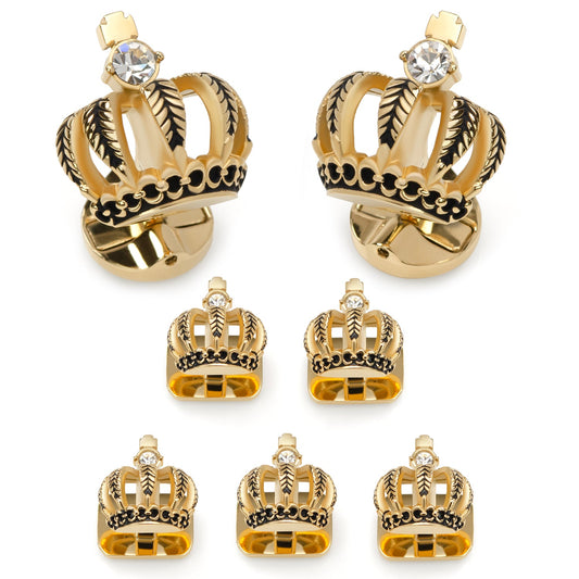 Gold crown-shaped earrings with gemstones on a white background