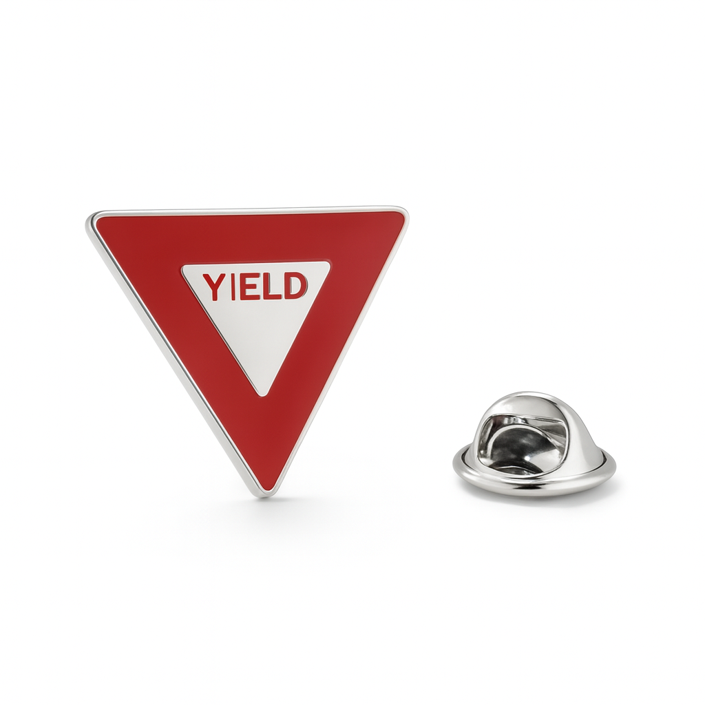 Yield sign lapel pin on a white background