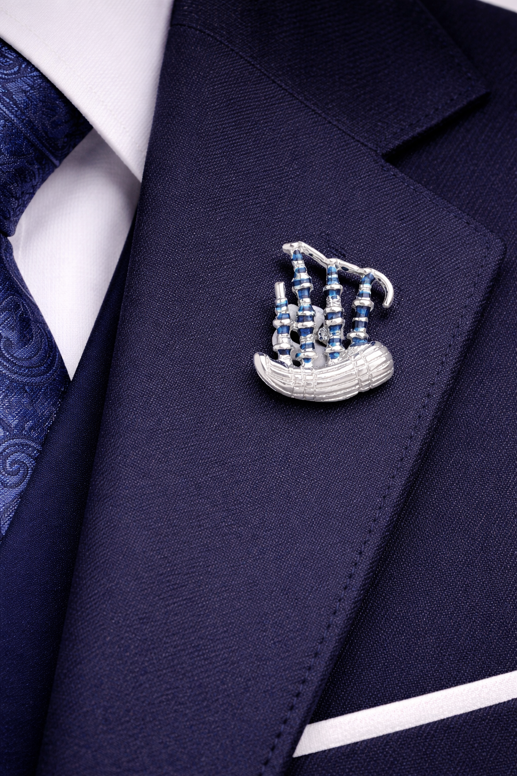 Navy blazer with a bagpipe pin on a man