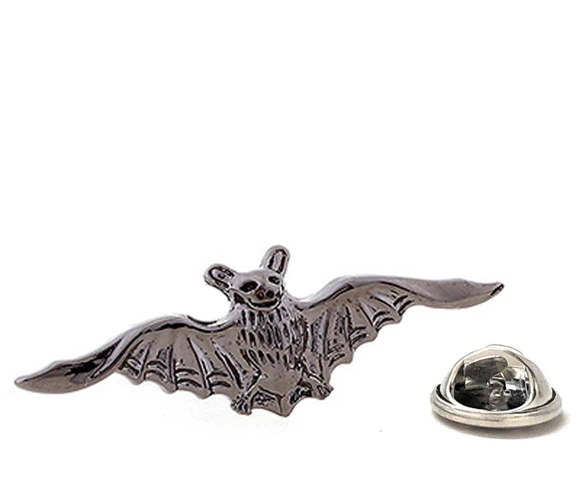 Metallic bat-shaped lapel pin on a white background