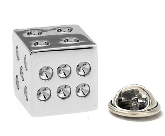 Silver dice-shaped object with a smaller silver heart-shaped object on a white background