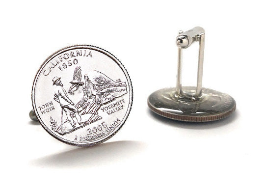 Silver coin with detailed design on a white background