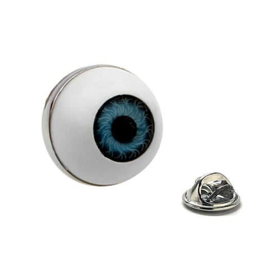 Eyeball-shaped pin with blue center on a white background