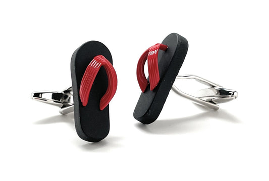 Black and red flip-flop cufflinks on a white background