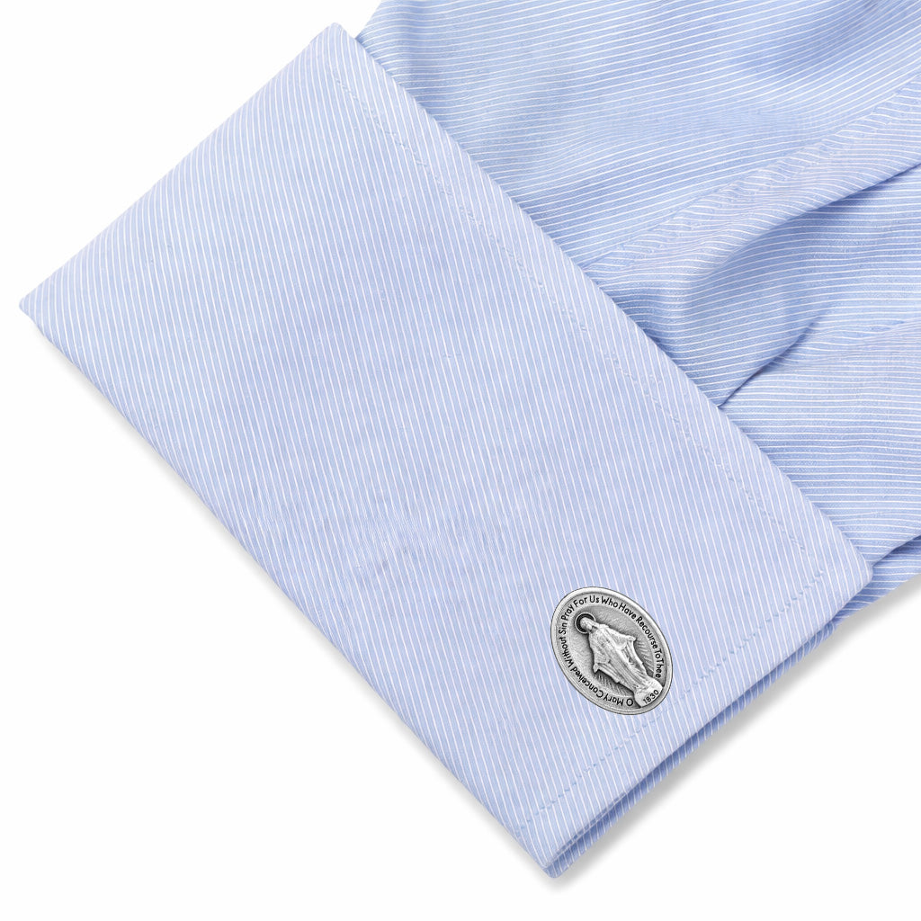 Miraculous Medal cufflinks featuring the Blessed Virgin Mary in silver-tone Catholic religious jewelry for men light blue shirt 