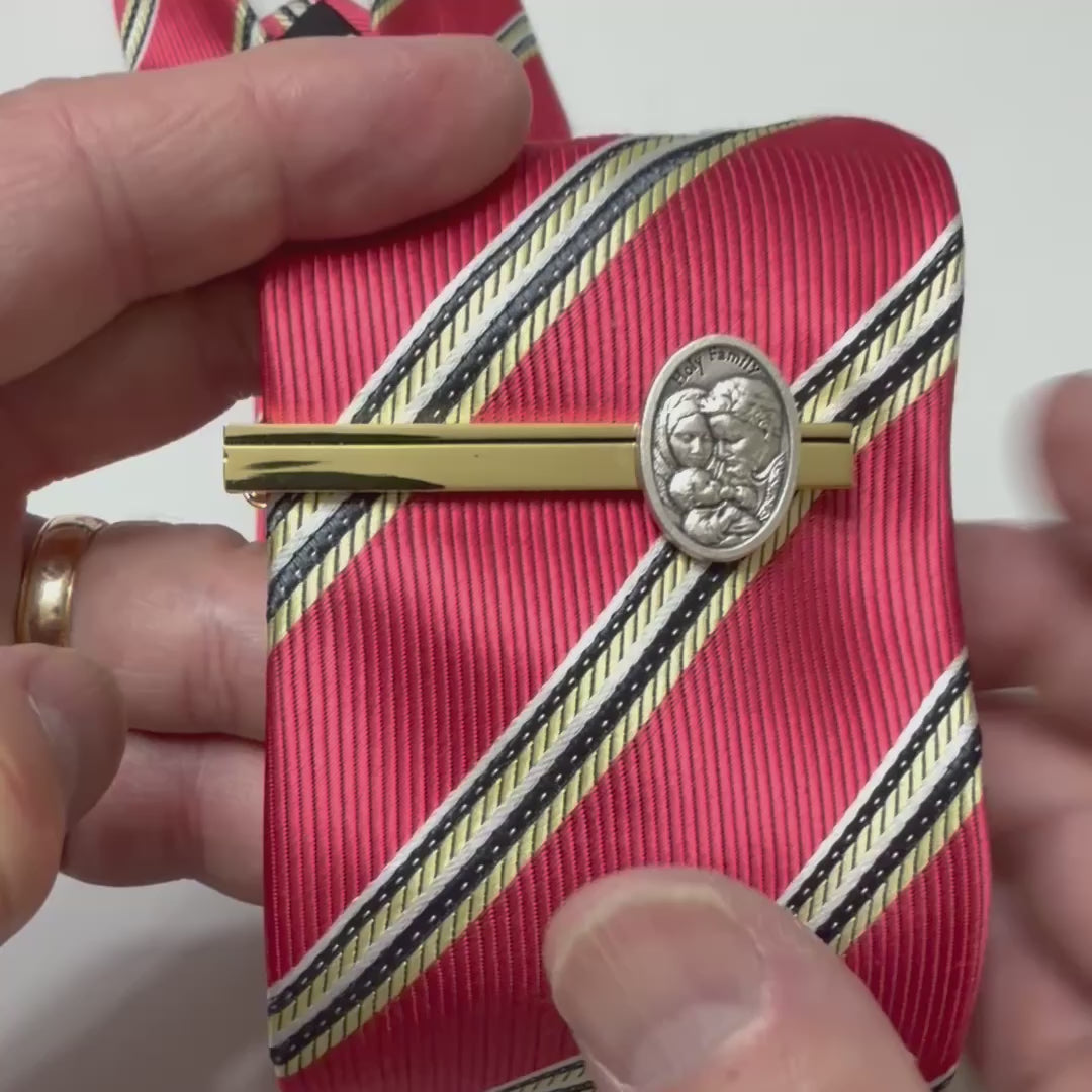 Holy Family Heritage gold tie clip featuring an antique silver Holy Family medallion on a polished gold tie bar.