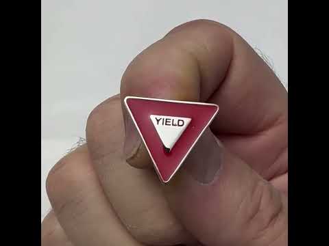 Triangular red and white yield road sign pin with butterfly clasp