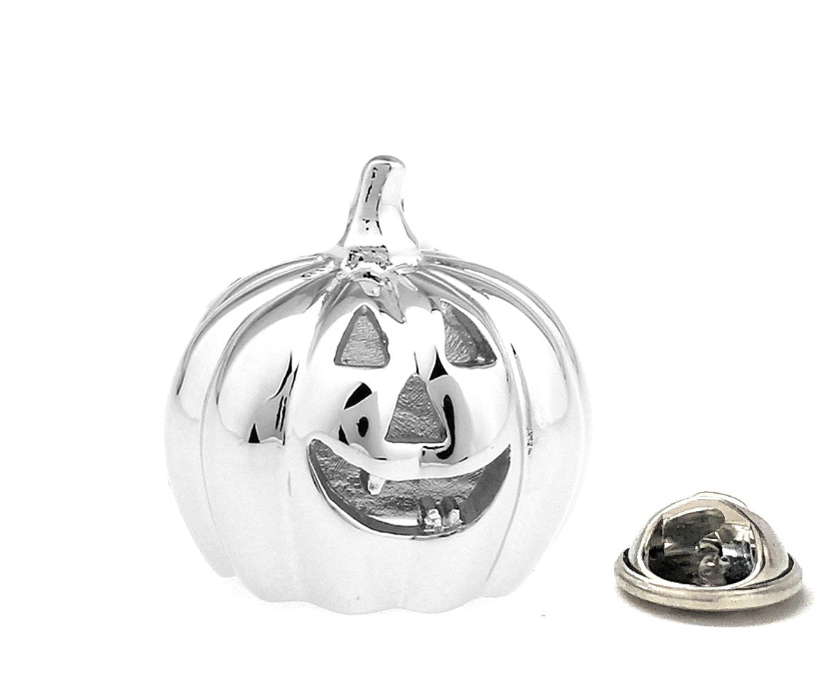 Silver pumpkin-shaped jewelry on a white background