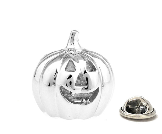 Silver pumpkin-shaped jewelry on a white background