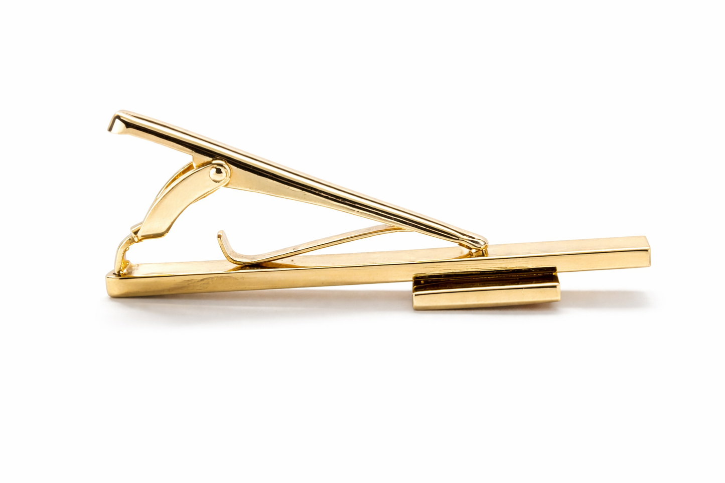 Gold tie clip on a white background