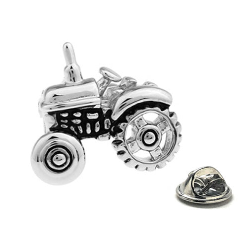 Silver farm tractor lapel pin with butterfly clutch backing – agricultural themed hat and jacket accessory.