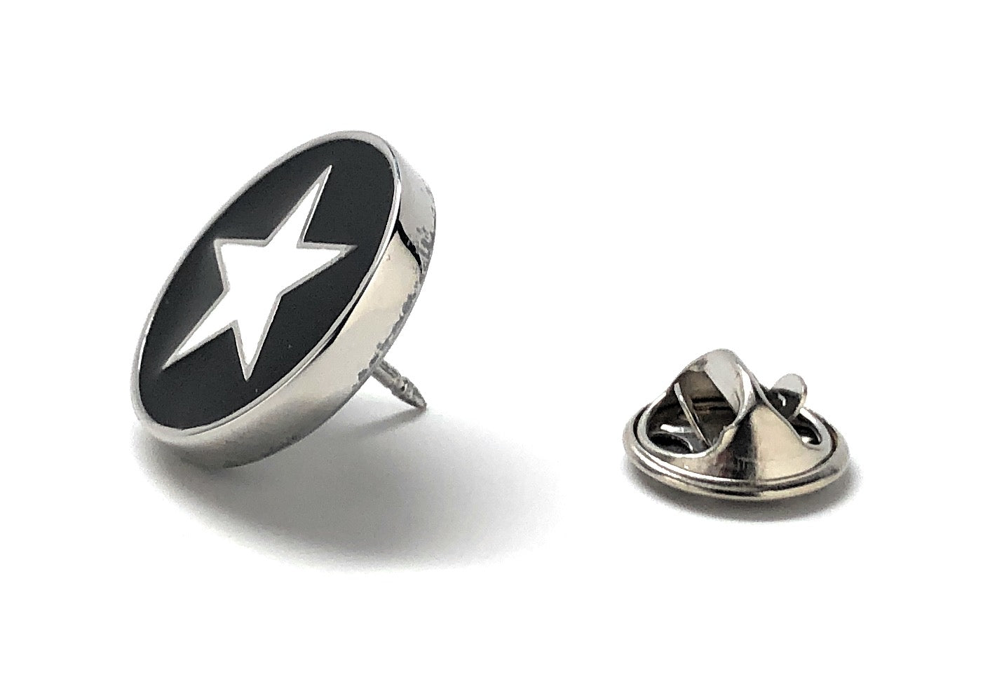 Pin with star design on a white background