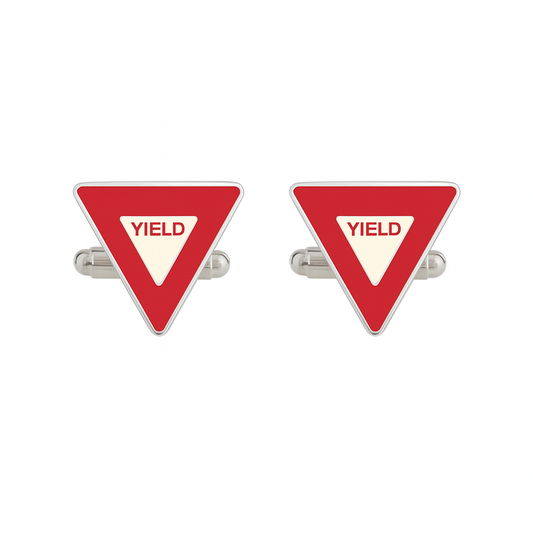 Red triangular yield sign cufflinks on a white background